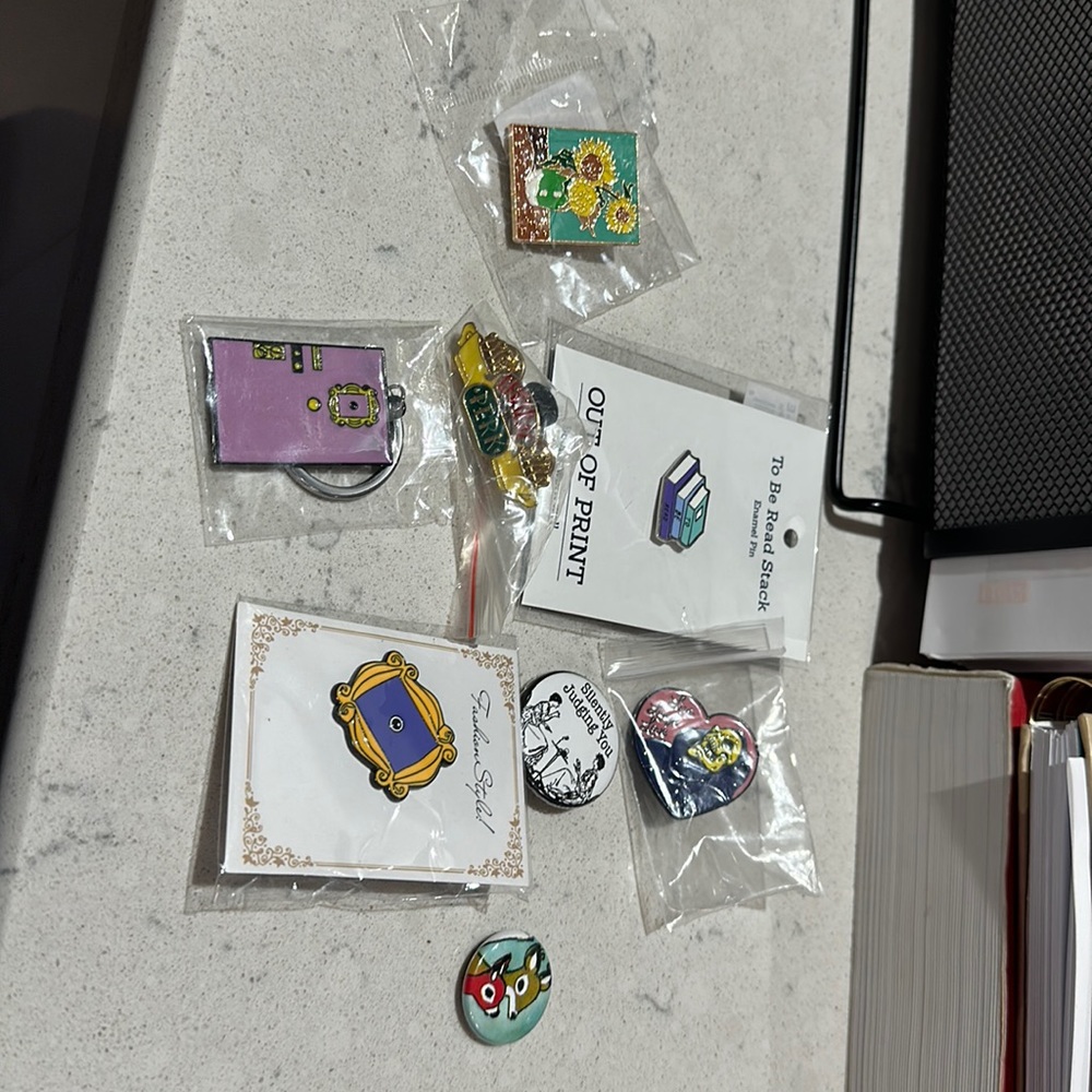 One keychain and 7 pins!